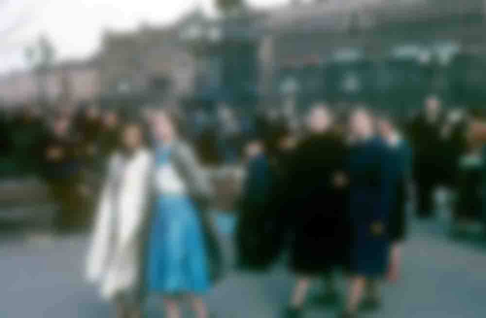 Young women walking past the statue of beloved poet Aleksandr Pushkin on Moscow's Pushkinskaya ploshchad.